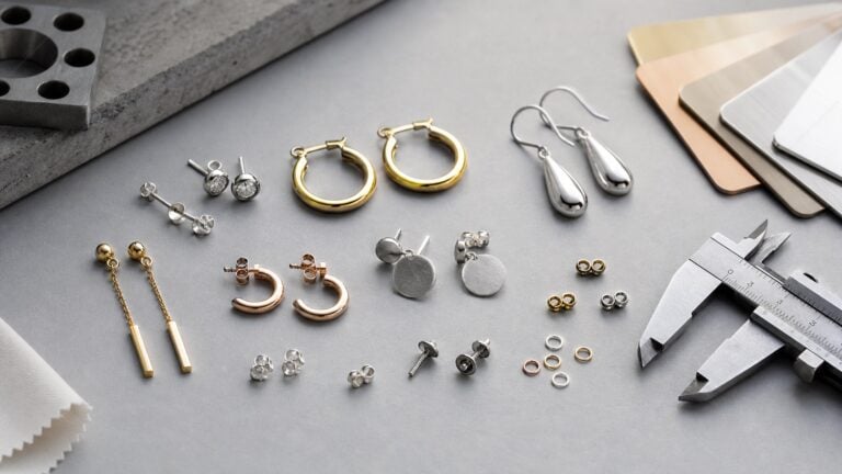Custom earring samples with posts backs hoops and finish swatches for manufacturing review
